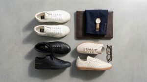 Sneaker brands for business casual work flat lay with Veja, Common Projects, and tailored blazer.